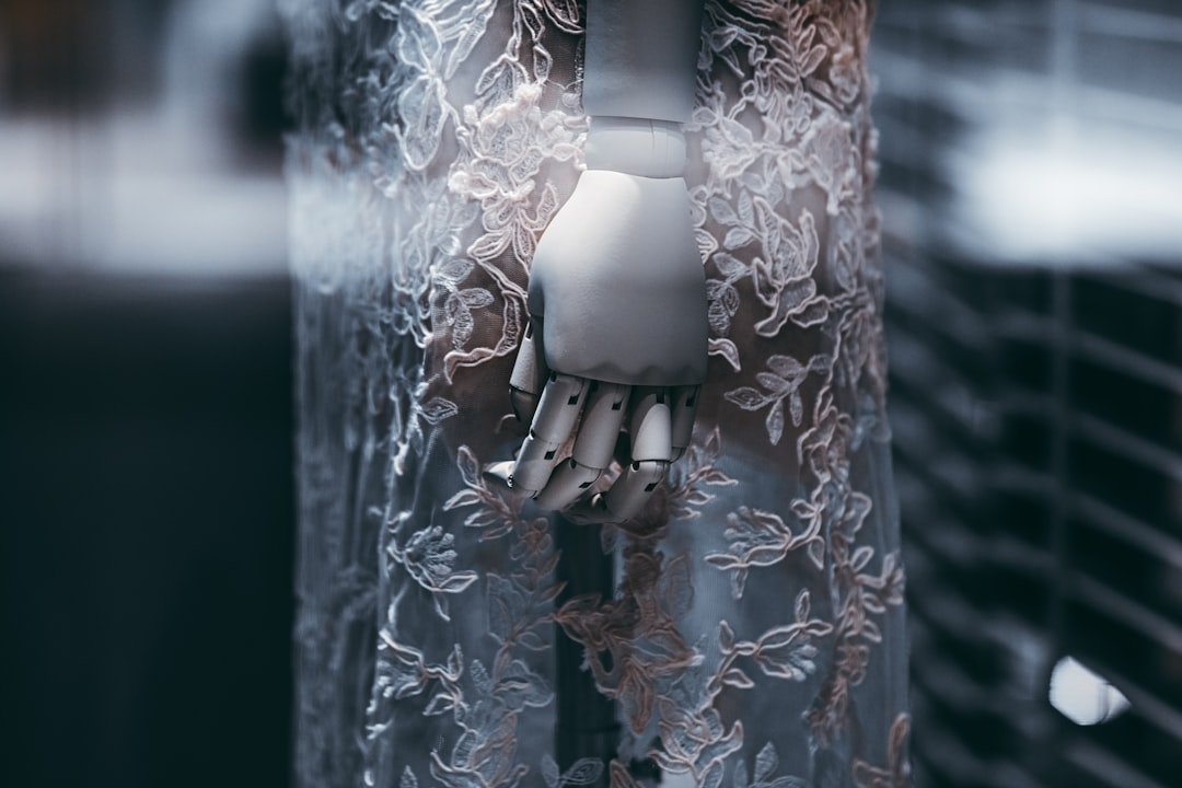 Futuristic humanoid robot shaking hands with professional woman in sleek glass office, holographic neural network floating between them, cool blue ambient lighting, clean modern workspace, AI collabor