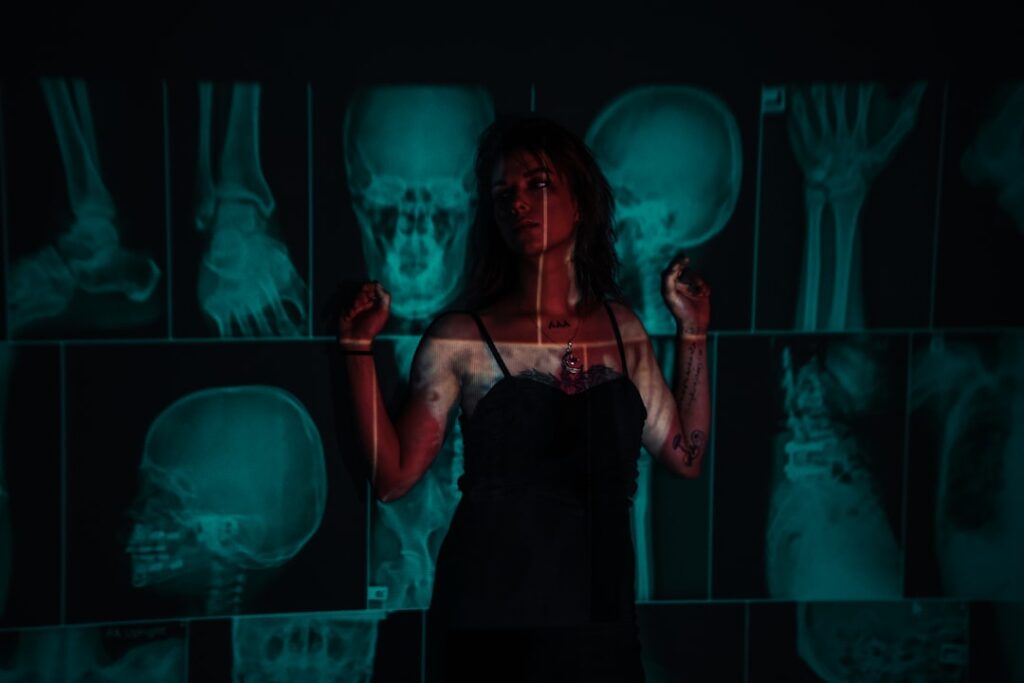Futuristic medical AI holographic display showing human body vitals, sleek ambient lighting, doctor interacting with transparent screen, clean modern hospital setting, blue and white tones, profession