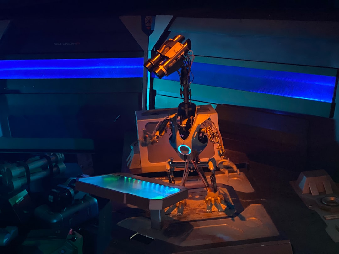 Human-robot collaboration at holographic workstation showing multimodal AI interfaces, sleek robotics arm alongside professional, ambient purple and cyan lighting, futuristic innovation lab setting