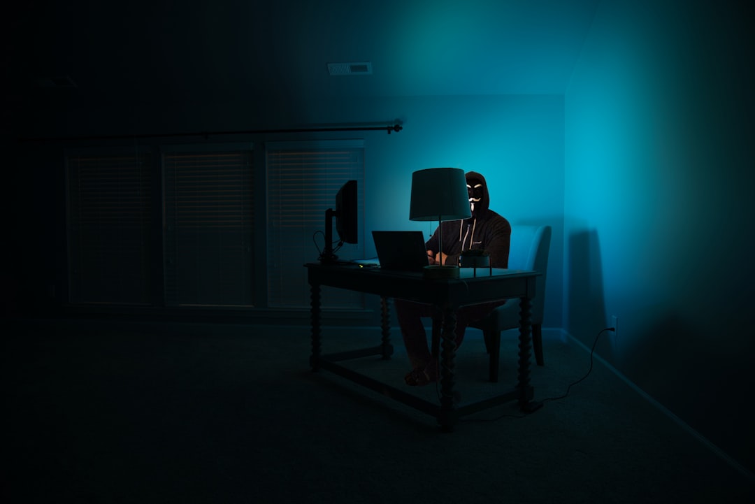 Cybersecurity analyst monitoring holographic threat map with shield icons, dark server room with red alert ambient lighting, sleek dashboard showing agent security protocols in real-time