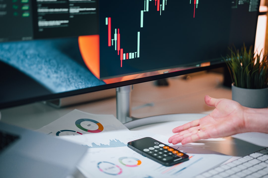 Modern bank office with holographic data visualization dashboard, cybersecurity analyst monitoring real-time fraud detection interface, sleek ambient lighting