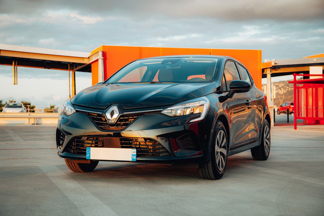 Renault electric vehicle charging at solar station, aerial view of green architecture, clean energy visualization, lush sustainable landscape, golden hour lighting, professional environmental tech pho