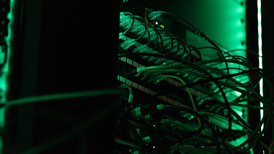 Futuristic autonomous AI agent hologram emerging from sleek server room with ambient blue lighting, professional technician observing neural network visualization on transparent display