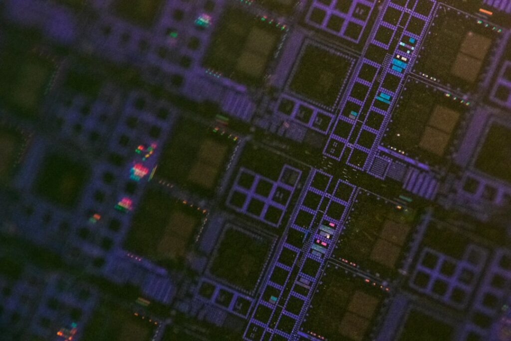 Extreme close-up of futuristic microchip with holographic neural network visualization, sleek black PCB with cyan ambient glow, professional tech photography, shallow depth of field, clean studio ligh