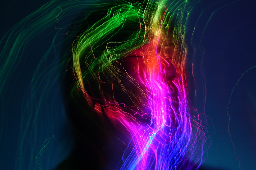 Emotional AI visualization with warm ambient light showing human silhouette connecting to colorful neural network nodes in clean modern office setting