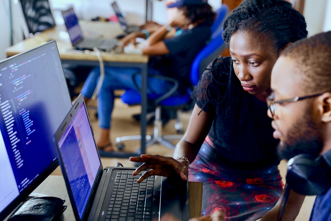African tech entrepreneurs in clean modern office with autonomous agent holograms, futuristic Lagos skyline through glass, warm ambient lighting, digital economy scaling concept