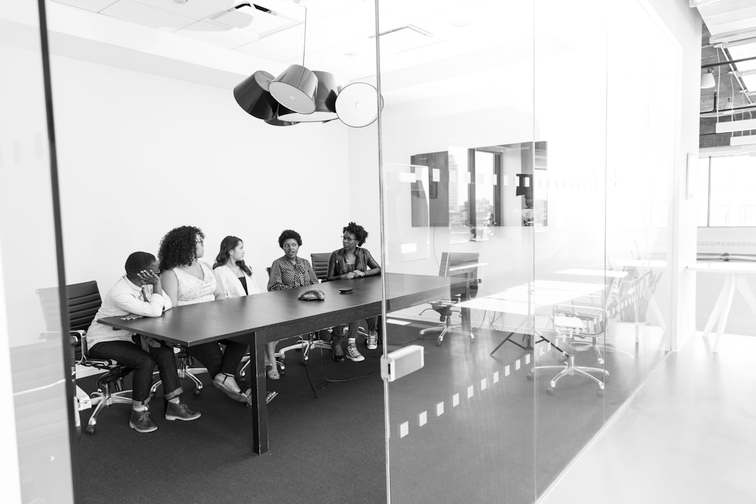 Diverse global leaders in minimalist white conference room with holographic world map, soft diffused lighting, human collaboration with AI interface, ethical governance concept, professional and seren
