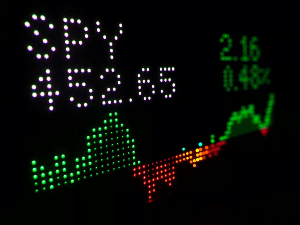 Futuristic stock market crash hologram with red descending graphs, professional in sleek suit, ambient blue lighting, data center background, financial AI failure concept