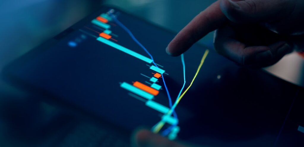 Professional executive analyzing holographic financial dashboard showing declining AI investment graphs in sleek dark data center with ambient blue lighting and worried expression