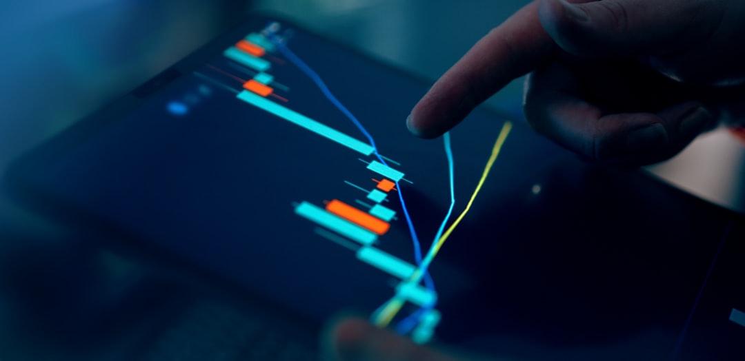 Professional executive analyzing holographic financial dashboard showing declining AI investment graphs in sleek dark data center with ambient blue lighting and worried expression