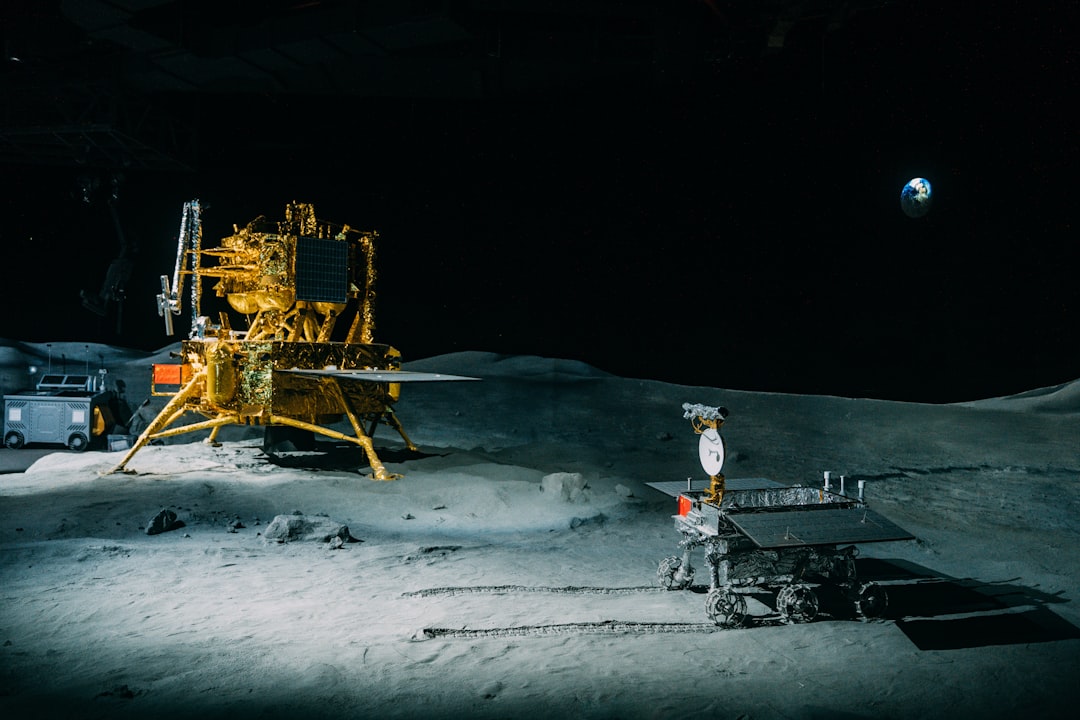 sleek lunar surface mining operation with robotic excavators, holographic mineral analysis overlay, dramatic earthrise lighting, professional sci-fi aesthetic, resource extraction technology visualiza