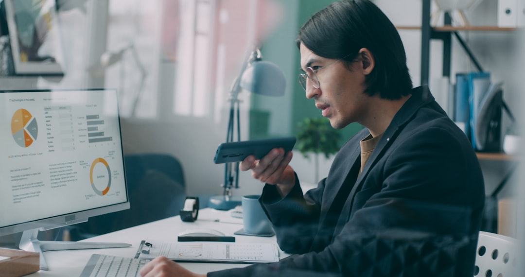 Professional woman analyzing a holographic cybersecurity dashboard with live data graphs floating in a clean modern office, AI ethics concept with warm and cool light contrast