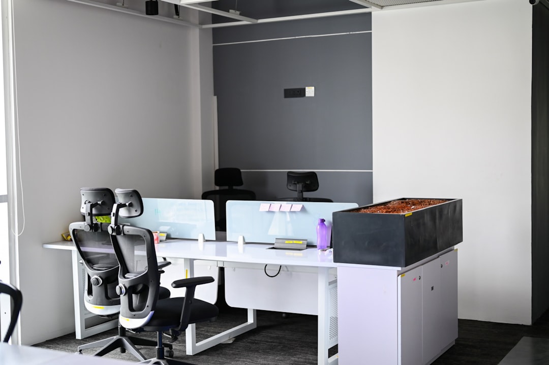 Human-robot collaboration in professional office, autonomous agent software on holographic display, sleek interface with decision trees, warm ambient lighting, modern workspace