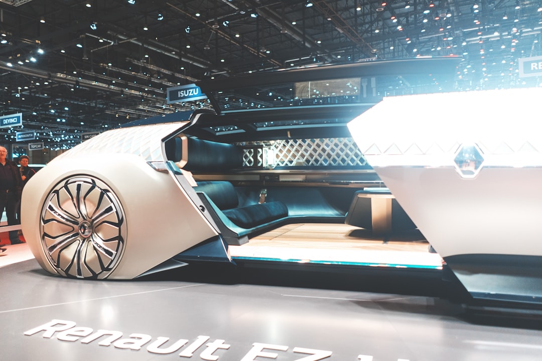 Futuristic Renault concept car interior with holographic AI dashboard display, neural network visualization overlay, ambient blue lighting, sleek minimalist design, professional automotive photography