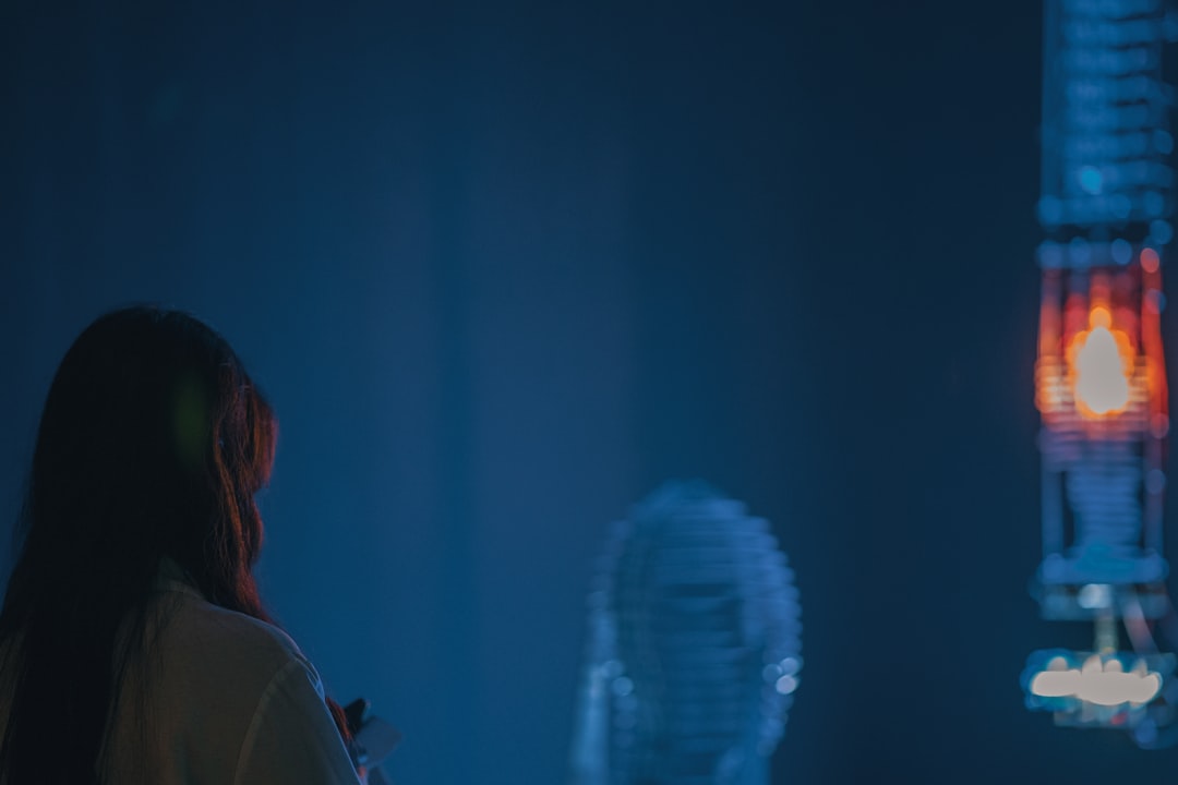 Diverse data scientist celebrating victory on futuristic Kaggle stage, holographic trophy projection, blue ambient lighting, cheering audience silhouettes, data visualization screens, sleek modern aud