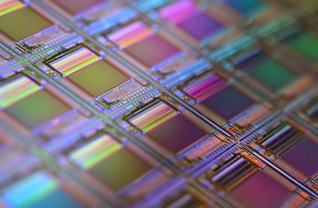 Futuristic AI neural network visualization merging with glowing microchip circuit patterns, sleek holographic display, ambient blue and purple lighting, professional tech lab setting