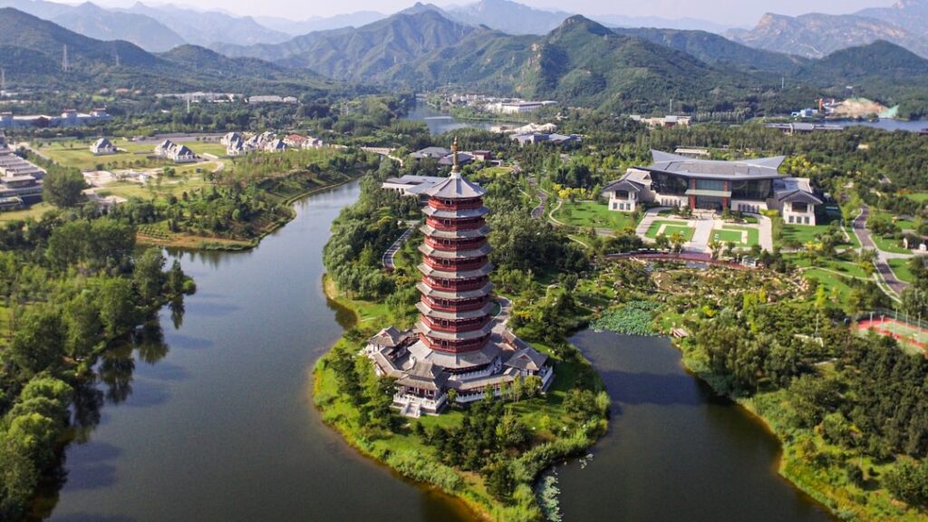 Aerial view of futuristic Chinese smart farm with autonomous tractors, drone swarms, holographic data overlays, golden hour lighting, sleek professional composition