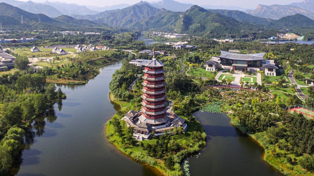 Aerial view of futuristic Chinese smart farm with autonomous tractors, drone swarms, holographic data overlays, golden hour lighting, sleek professional composition
