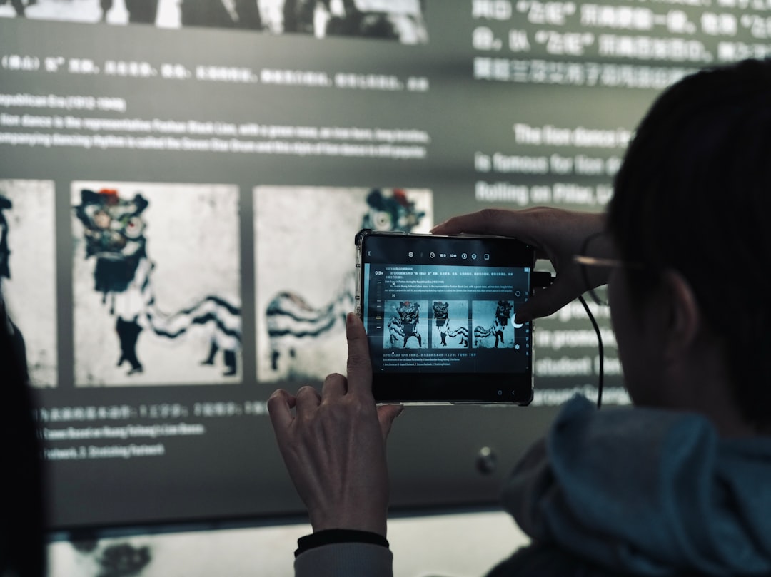 Close-up of sleek transparent tablet displaying neural network water optimization data, farmer's hands interacting with holographic soil analysis, clean modern agricultural lab setting