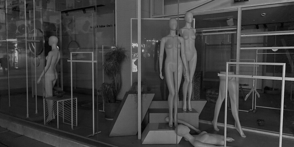 Futuristic fashion fitting room with holographic body scan, sleek ambient lighting, diverse model silhouette with measurement lines, clean modern tech environment, professional editorial style