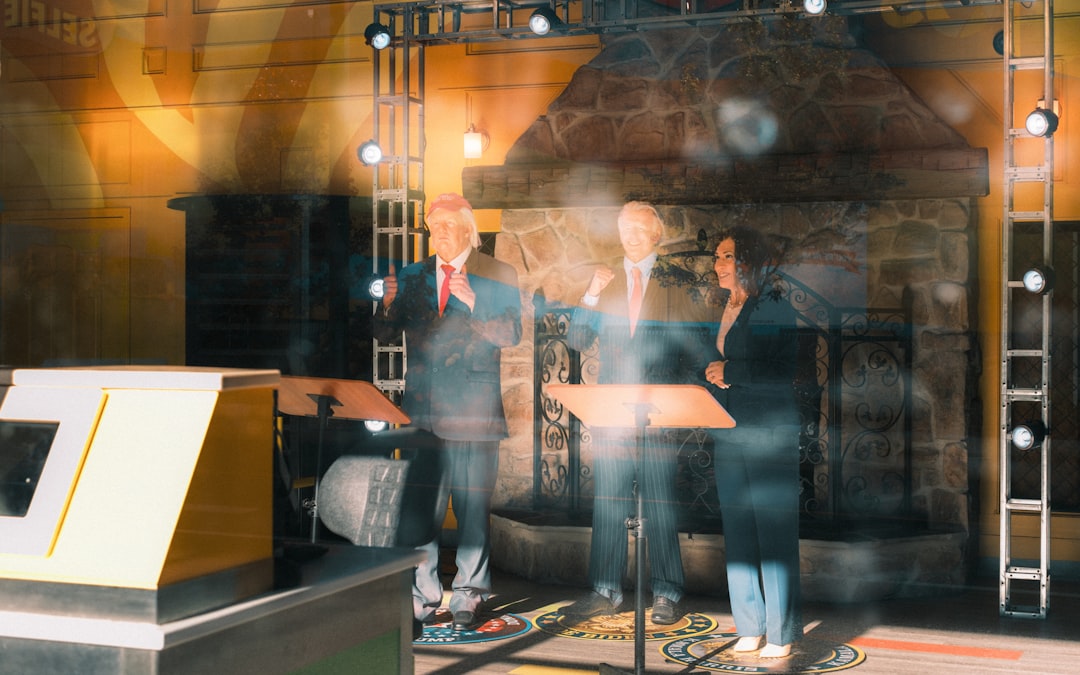 Diverse team of engineers collaborating around holographic ethics framework display, warm golden ambient lighting, clean modern tech office, human-robot harmonious balance, hopeful innovation atmosphe