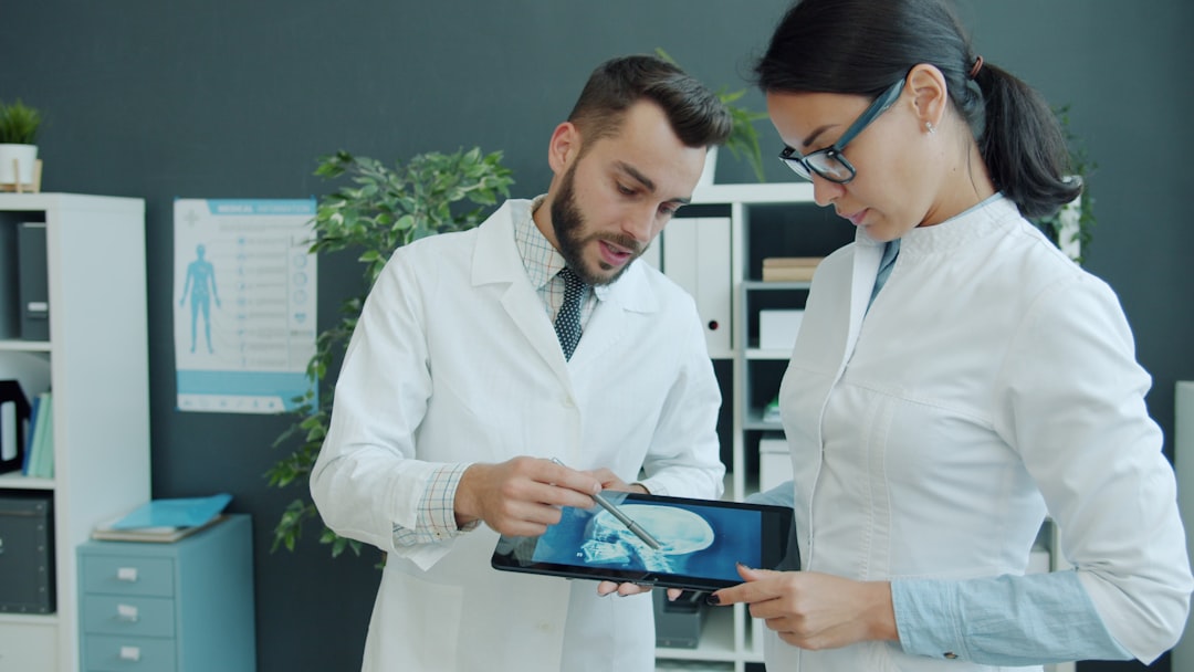 Medical professional analyzing AI-generated cost graphs on transparent screen, modern hospital corridor background, holographic economic metrics, professional warm lighting, human-technology collabora