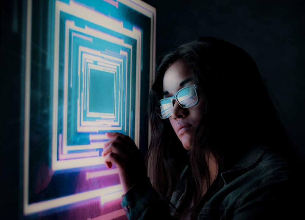 Futuristic AI agent holographic interface with neural network visualization, professional woman in sleek ambient-lit modern office, blue-purple data streams