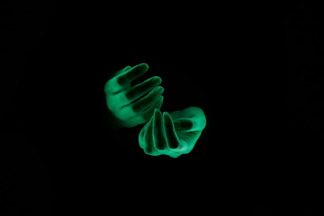 Human hands reaching toward glowing AI ethics balance scale hologram, dark cybersecurity command center background, dramatic ambient lighting, regulatory compliance data visualization screens