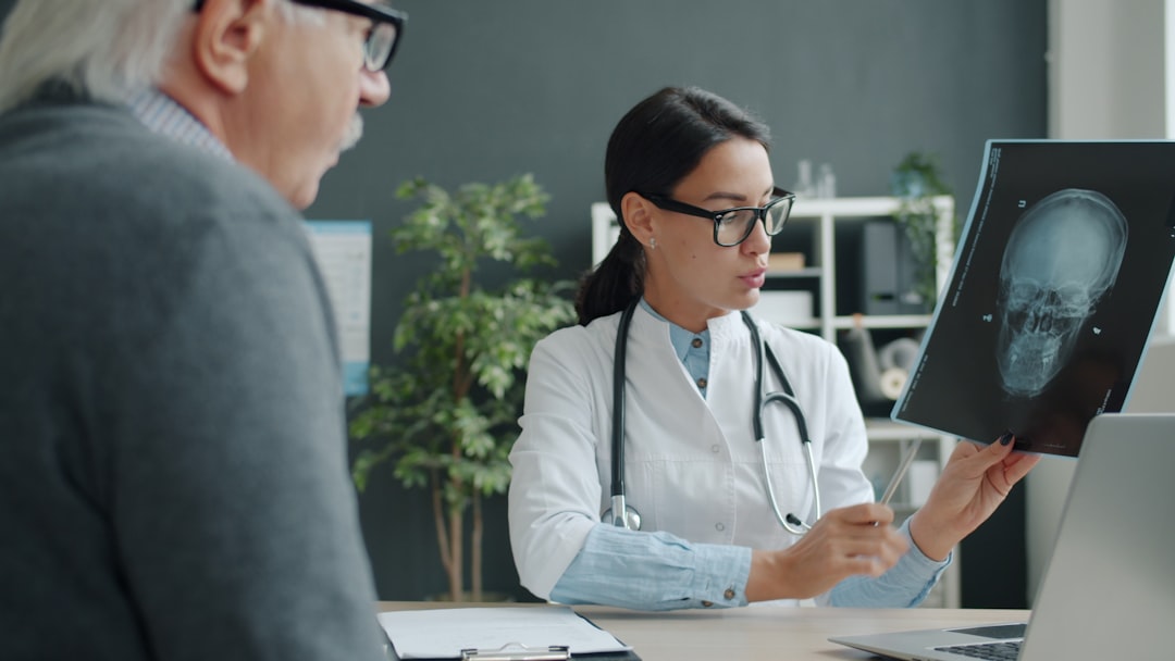 Split-screen medical AI scene: surgeon reviewing holographic brain scan with robotic surgical arm, real-time data dashboard, warm and cool dual lighting, futuristic hospital setting, human-robot colla