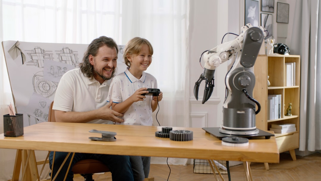 Human-robot collaborative workspace, sleek robotic arm and professional designer working together at clean modern desk, holographic product prototype between them, warm ambient lighting with blue acce