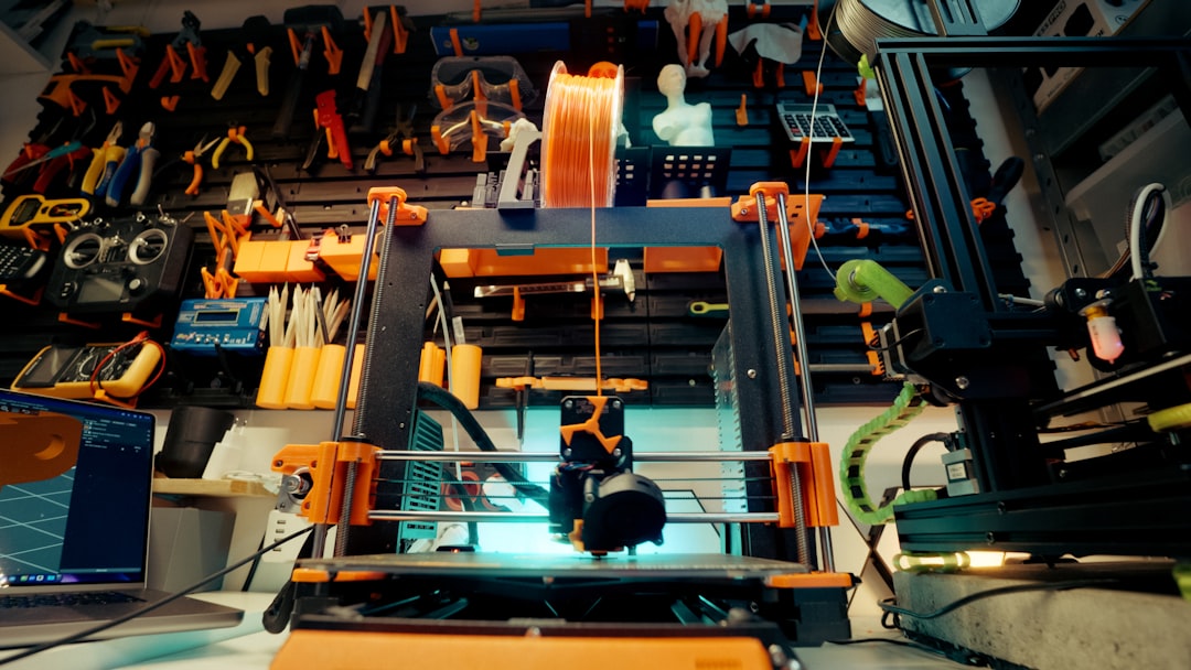 Human engineer collaborating with robotic arm in smart factory, holographic maintenance prediction overlay on industrial machinery, dramatic ambient lighting, microchip detail reflections, Industry 4.